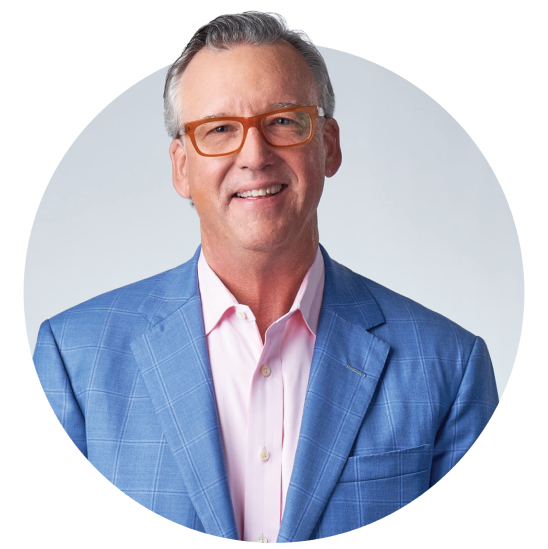 Edmund F. Murphy III, President and CEO of Empower, smiles while wearing a blue suit and glasses.