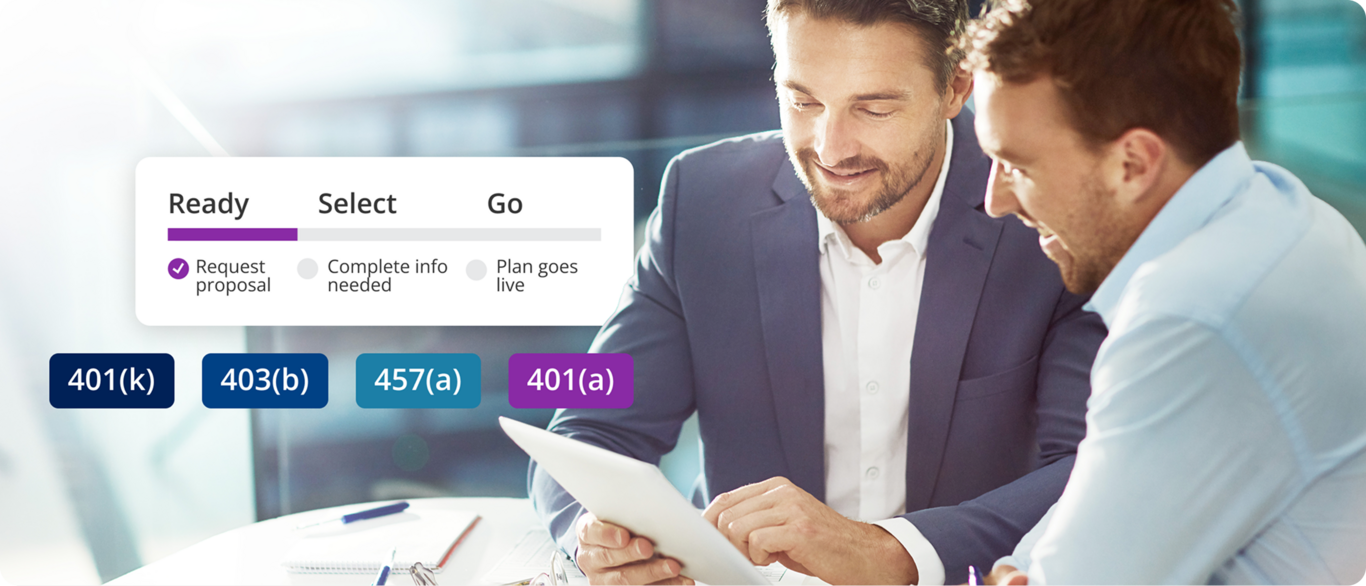 Two men sit at a desk reviewing financial documents. Ready. Select. Go. 